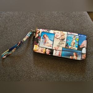 Marylin/vogue style wallet with wrist strap. Has many spaces for cards and money